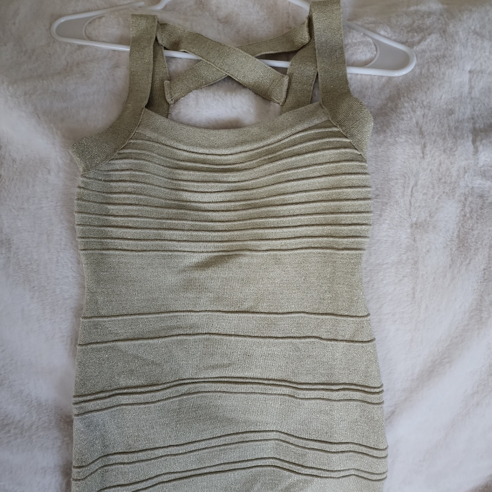NEWHot Miama Style dress. Back has lots of straps. Form fitting sparkly gold ✨️
